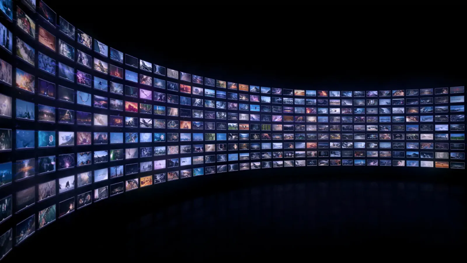 Hundreds of glowing video tiles arranged on a curved wall in a dark studio